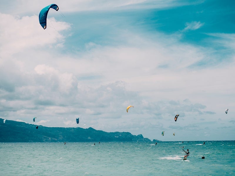 Kitesurfers at Kanaha Beach Park in Kahului, Maui
